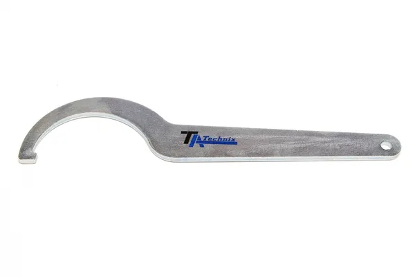 Llave de ajuste para el apoyo de resorte de bobina